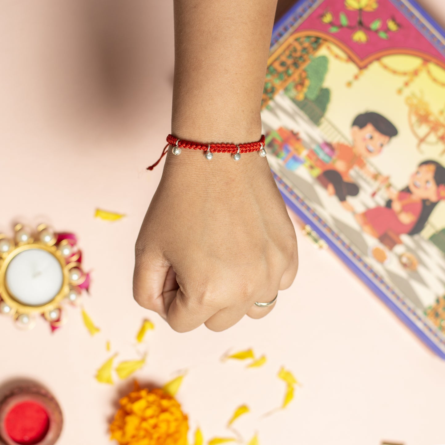 Handwoven Beaded Rakhi with Red Thread