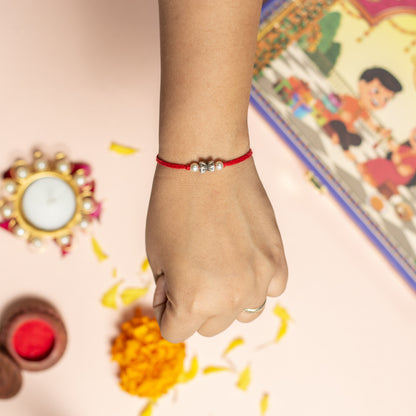 Silver Damru With Pearl Rakhi