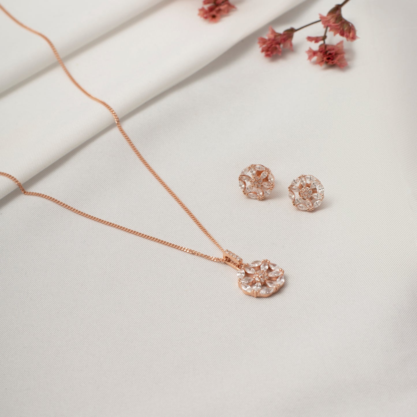 Rose Gold Snowflake Pendant and Earring Set with Crystal Accents