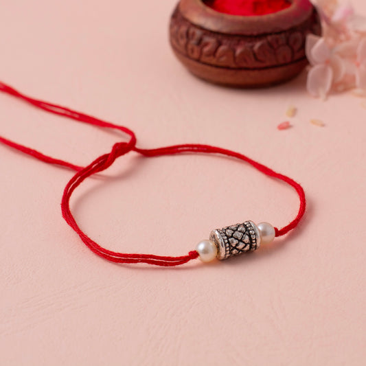 Vintage Pearl and Silver Charm Rakhi